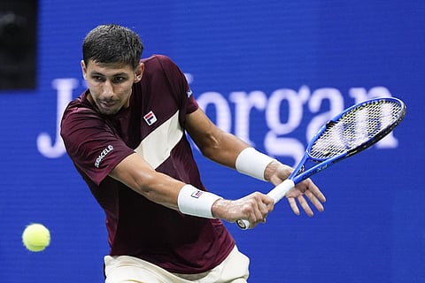 US Open 2024: Alexei Popyrin, of Australia, returns a shot to Novak Djokovic, of Serbia